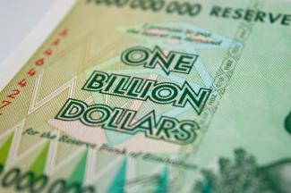 a one billion dollar bill with the words one billion dollars printed on it by Rob courtesy of Unsplash.